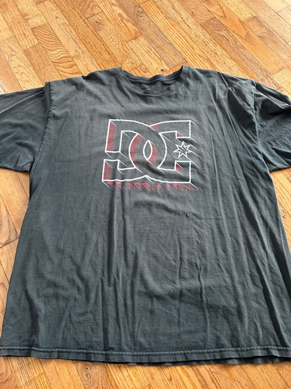 DC Black Short-Sleeve Graphic Tee with Red-Accented Logo